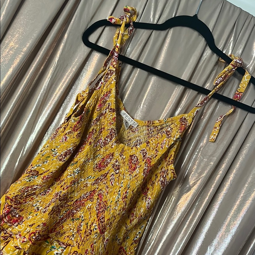 Torrid’s “Festi” Yellow Floral Tie-Shoulder Jogger Jumpsuit